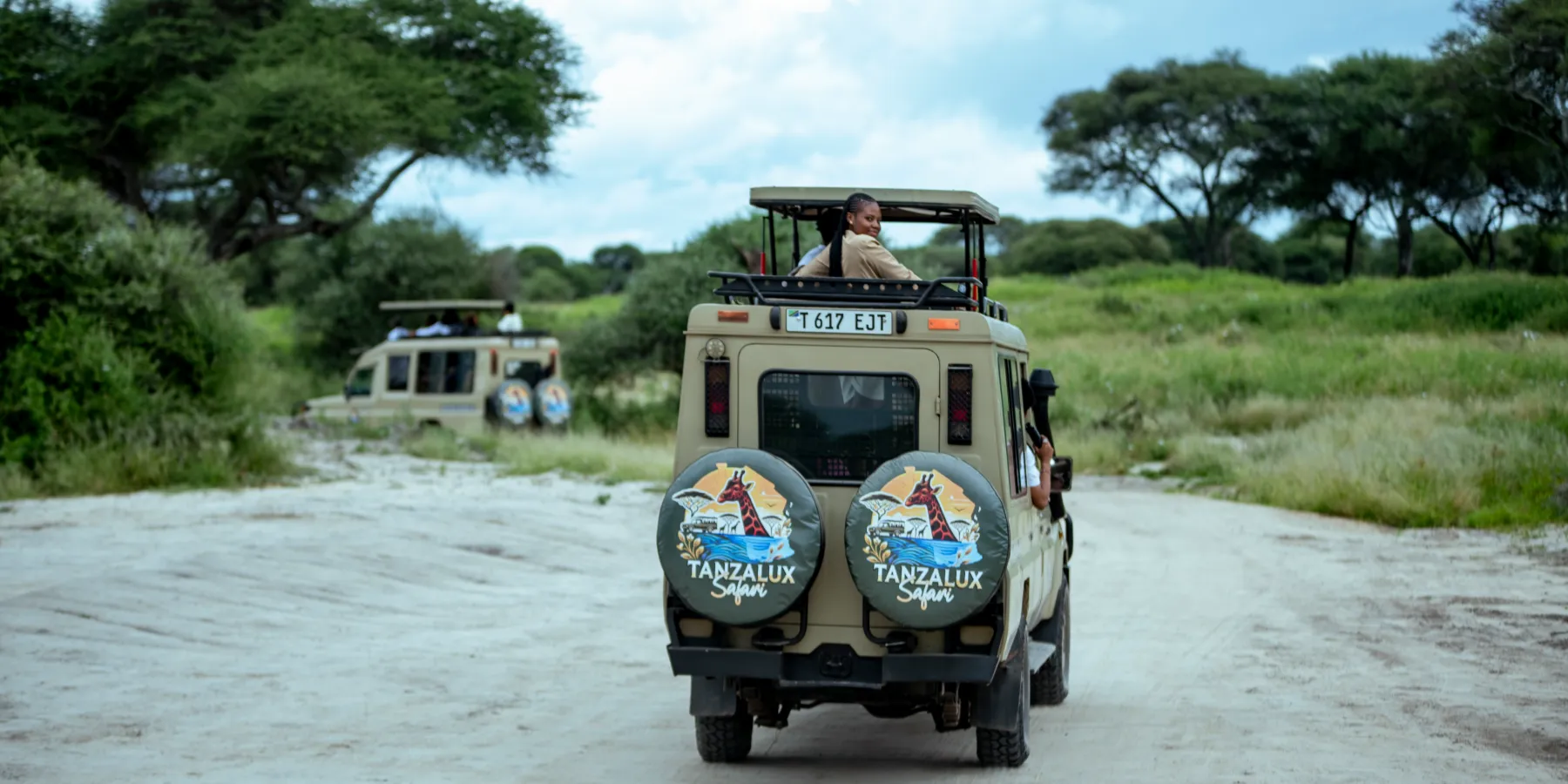 Two TanzaLux safari vehicles on a game drive